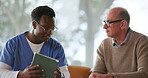 Nurse, senior man and conversation with tablet on sofa for healthcare, communication or consultation in home. Caregiver, advice and talking to mature person for help, support and medical results
