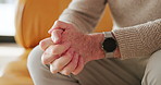 Hands, pain and elderly man in home with health problem, arthritis or osteoporosis with strain. Fingers, sore and senior person with injury, parkinson and massage for fibromyalgia in retirement