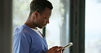 Nurse, black man and reading with tablet by window, research protocol or procedure for surgical assistance. Theater attendant, tech or employee in hospital, medical education and learn for healthcare