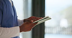 Person, hands and caregiver with tablet for online checklist, medical analysis or digital report. Closeup, healthcare worker or nurse scrolling with technology for research or telehealth in clinic