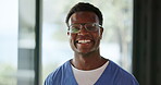 Face, nurse and man with glasses, hospital and happiness for career growth in healthcare or wellness. Medical professional, confident and black person with eyewear, laughing and clinic in Nigeria
