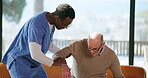 Caregiver, helping and senior man at house with assistance, balance and healthcare support. People, volunteer and elderly person with disability, mobility and medical services of rehabilitation guide