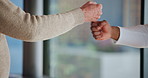 Fist bump, trust and nurse with old person in clinic for retirement, volunteer and support. Assisted living, kindness and elderly care with hands of people for counseling, empathy and healthcare