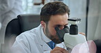 Man, forensic and research with microscope for medical or scientific study in laboratory. Male person, science and healthcare discovery with biotechnology for investigation, exam results or analysis
