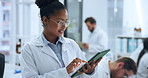 Woman, reading and research in lab with tablet for project review, evaluation notes and science report. Medical, person and scroll in clinic with tech, study results and pharmaceutical development.