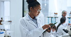 Woman, scroll and science in lab with tablet for project review, evaluation notes and research report. Medical, person and reading in clinic with tech, study results and pharmaceutical development.