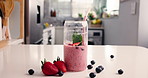 Health, time lapse and smoothie in glass in kitchen for diet, detox and nutrition. Antioxidants, breakfast and weight loss with strawberry drink in home for protein shake, fiber and vitamins