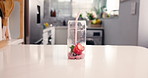 Health, fruit and smoothie in glass in kitchen for diet, detox and nutrition ingredients. Antioxidants, breakfast and weight loss with strawberry drink in home for protein shake, fiber and vitamins