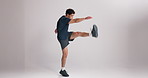 Fitness, man and stretching legs in studio to start workout, muscle preparation and physical activity. Mockup space, energy and athlete with warm up on white background for exercise and getting ready