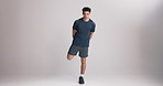 Face, man and stretching legs in studio to start exercise, muscle preparation or physical activity. Mockup space, athlete and static warm up on white background for fitness endurance or getting ready