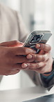 Phone, typing and hands of business worker with notification for email, networking and communication. Corporate office, online and person on smartphone for contact, website and internet for research