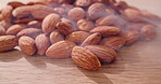 Cleaning, almond and nuts on wood with steam for sterilization, food safety and skin removal. Seeds, products and heat for kernel hygiene, roasting preparation and quality assurance for production
