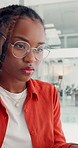 Business, black woman and typing on computer in office for research, proofreading and editor feedback. Person, pc and glasses reflection to review article, copywriting report and publication schedule