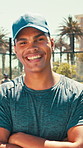 Padel, sports and face of man outdoor on tennis court to start training, practice and exercise. Crossed arms, fitness and portrait of person with pride, laugh and happy for workout, challenge or game