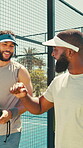 Friends, padel and start game with fist bump, teamwork or partner motivation for practice match. Support, outdoor activity or people walk to tennis court with racket, sport training and ready to play