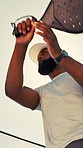 Padel, sports and below of man in game, match and training on outdoor tennis court for practice. Low angle, sunshine and person with racket, ball and playing for workout, exercise and competition
