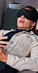 Mental health, woman or speaking on couch with blindfold for sensory awareness, therapy or consultation. Psychology, female person and talk on sofa with sleep mask for counseling, help or evaluation.