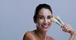 Laughing, woman and makeup brush for glow, face and confident with tool, studio or purple background. Mockup space, happiness and mature person with smile for foundation application or cosmetics