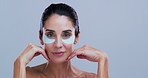 Face, dermatology or woman with eye patches for anti aging, collagen treatment or skincare. Portrait, beauty cosmetic or gel pad for dark circles, hydration or mature model on studio background space