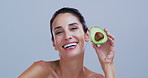 Happy woman, face and avocado in studio, skincare and confident with mock up space on background. Mature person, smile and organic fruit in portrait, beauty and pride with benefits in Argentina
