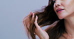 Damage, hair and hands of woman in studio for frizz treatment, growth and healthy texture. Salon, space and person with strands for grooming routine, hygiene and cosmetics on white background