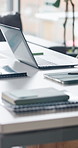 Background, business and finance with laptop on desk in empty office for email or networking. Corporate, interior and still life with computer in financial workplace for connectivity or digital tech