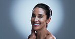 Face, mature and happy woman in studio with skincare for collagen, retinol and anti aging benefits. Confident, smile and female person with beauty, dermatology and smooth skin on grey background.