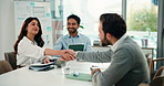 Business people, handshake and documents with team in meeting for b2b deal or negotiation in office. Employees, group and shaking hands together for proposal, collaboration or project at workplace