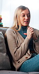 Mental health, talk and woman with anxiety on sofa for therapy consultation, advice and support. Psychology, patient and person with depression on couch for counseling appointment, wellness and help.