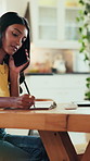 Woman, writing and phone call in home with laptop for remote work, journalism research or gathering info. Journalist, talk and typing with tech for contact, fact checking notes and story development.