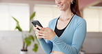 Typing, laugh or woman in fitness studio with phone, funny message or exercise video on social media. Happiness, digital or girl in gym with mobile, virtual tutorial or meme reaction on pilates break