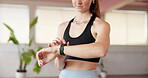Fitness, sports watch or woman in studio with scroll, tracking performance or time check in workout session. Sport, training or athlete in gym with tech, milestone or digital target for progress.
