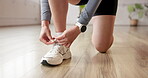 Athlete, hands and tie shoes in gym to start workout, training or exercise. Fitness, woman and tying footwear or sneakers for sport to get ready or prepare for cardio, health and wellness in club