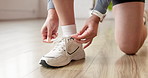 Exercise, hands and tie shoes in gym to start workout, training or fitness. Woman, athlete and tying footwear or sneakers for sport to get ready or prepare for cardio, health and wellness in club