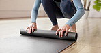 Yoga mat, rolling and woman in health club, meditation and balance with wellness, exercise and stress relief. Person, fitness and break in studio, energy and start with workout and inner peace