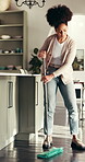 Dance, cleaning home and woman mop floor for hygiene maintenance, housework or sanitation. Music, chores and happy African person with disinfection, bacteria safety and housekeeping in kitchen