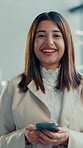 Happy woman, phone and face in lobby at office for pride, confidence or networking at media company. Person, journalist and smile with smartphone, portrait and application in foyer at creative agency
