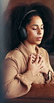African woman, headphones and meditation at house for streaming podcast, breathe and mindfulness. Female person, stress relief and calm audio for zen practice, holistic balance and wellness technique