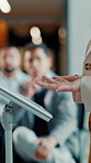 Business, hands and woman with presentation, podium and financial conference with speech. Presenter, audience and crowd with speaker, economy event and investor symposium with trading workshop