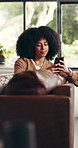Phone, smile and woman relax in home for social media post, notification or reading message. African person, living room and mobile for online communication, check text and network on internet app