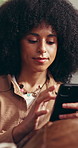Woman, scroll and phone on sofa with social media for text message, online chat or communication. Female person, reading or typing on couch with tech for mobile app, internet or conversation in home.