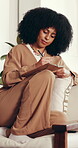 Writing, ideas and woman with journal, home and creative for fiction novel on couch and living room. Plan, story and African person with notebook for inspiration, info and author with notes in house