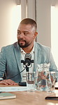 Business, podcast and man with microphone, talking and trading advice with content creation. Person, financial presenter and radio with equipment, influencer or media agency with recording broadcast