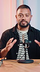 Microphone, podcast and man in studio, face and entertainment with content creation. Person, presenter and recording broadcast with live streaming, influencer or media agency with communication