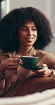 Coffee, smile an thinking with woman in living room of home for break, me time or weekend wellness. Beverage, relax and vision with happy person drinking caffeine in apartment lounge for satisfaction