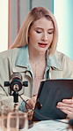 Microphone, tablet and podcast with influencer woman in recording studio for live radio broadcast. Interview, media and content creator with talk show host streaming subscription service on air