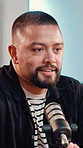 Mic, man and talking on podcast in studio with online interview, personal story and career news. Content creation, guest and live stream with tech on air for public relations, talk show and broadcast