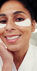 Beauty, eye mask and face of woman in bathroom of home for cosmetic or skincare routine. Antiaging, dermatology product and smile of happy person in apartment for facial treatment satisfaction