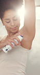 Hygiene, woman and spray deodorant in bathroom for morning routine, odor control and fresh scent. Self care, african person and armpit antiperspirant in home for underarm fragrance and getting ready