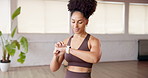 Studio, check smart watch and woman with fitness information, workout progress and smile. African person, wristwatch and tracking with exercise app to monitor heartbeat, health and performance timer